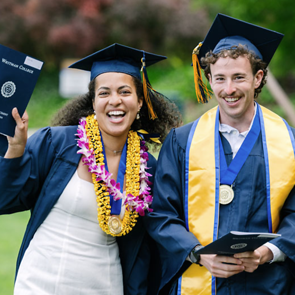 Image of two Whitman College graduates from the Class of 2024.