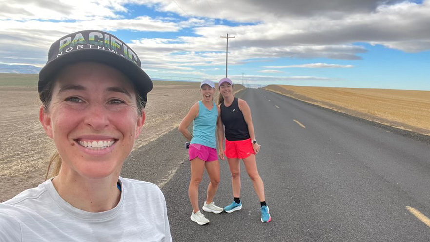 Three runners on a country road