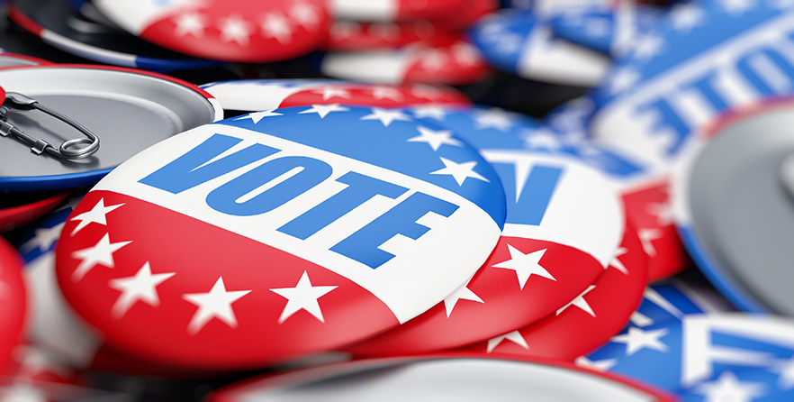 Election buttons scattered with the word "VOTE".