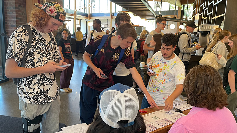 Whitman students helping other students register to vote at Cleveland Commons.