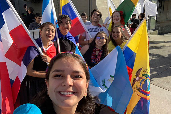 Whitman College students carrying a variety of flags.