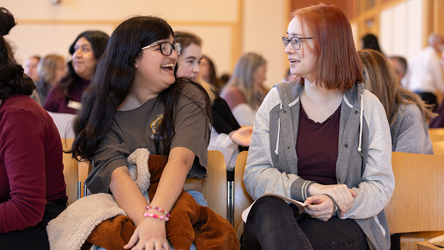 Whitman College students engage in conversation before the presentation. 