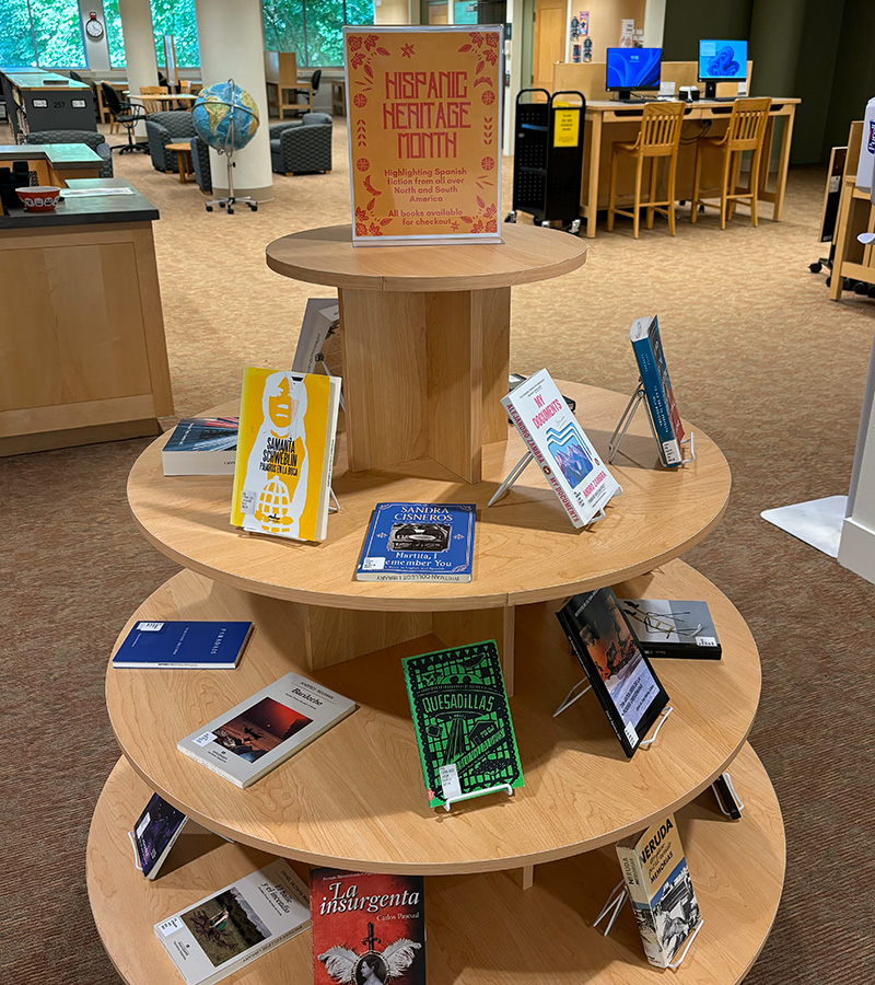 A Hispanic Heritage Month display in the library lobby highlights Spanish-language fiction from around the Americas.