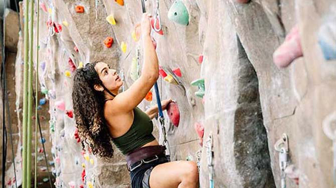 Rock climber on the indoor climbing wall.