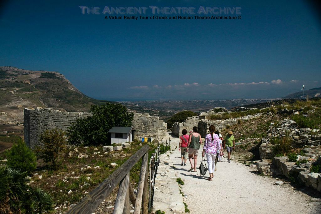 Segesta Theatre: Approaching rear of theatre from the South. Rear of the containing wall (analemmata) constructed of limestone blocks. Photo: T. Hines, 2019.
