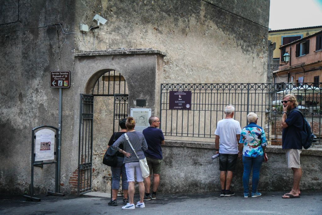 Unassuming entrance to odeum just outside the restored city gate to the old city (Porta Messina)